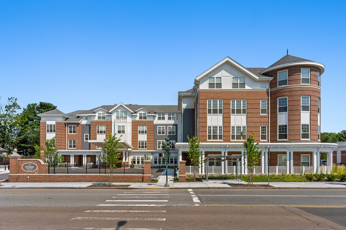 Image of an exterior view of a senior living facility, Sunrise Newton.